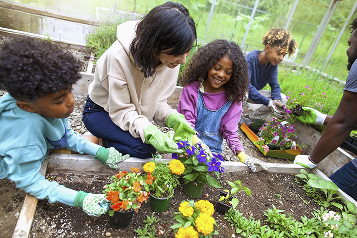 Children gardening as part of a nonprofit community outreach with project